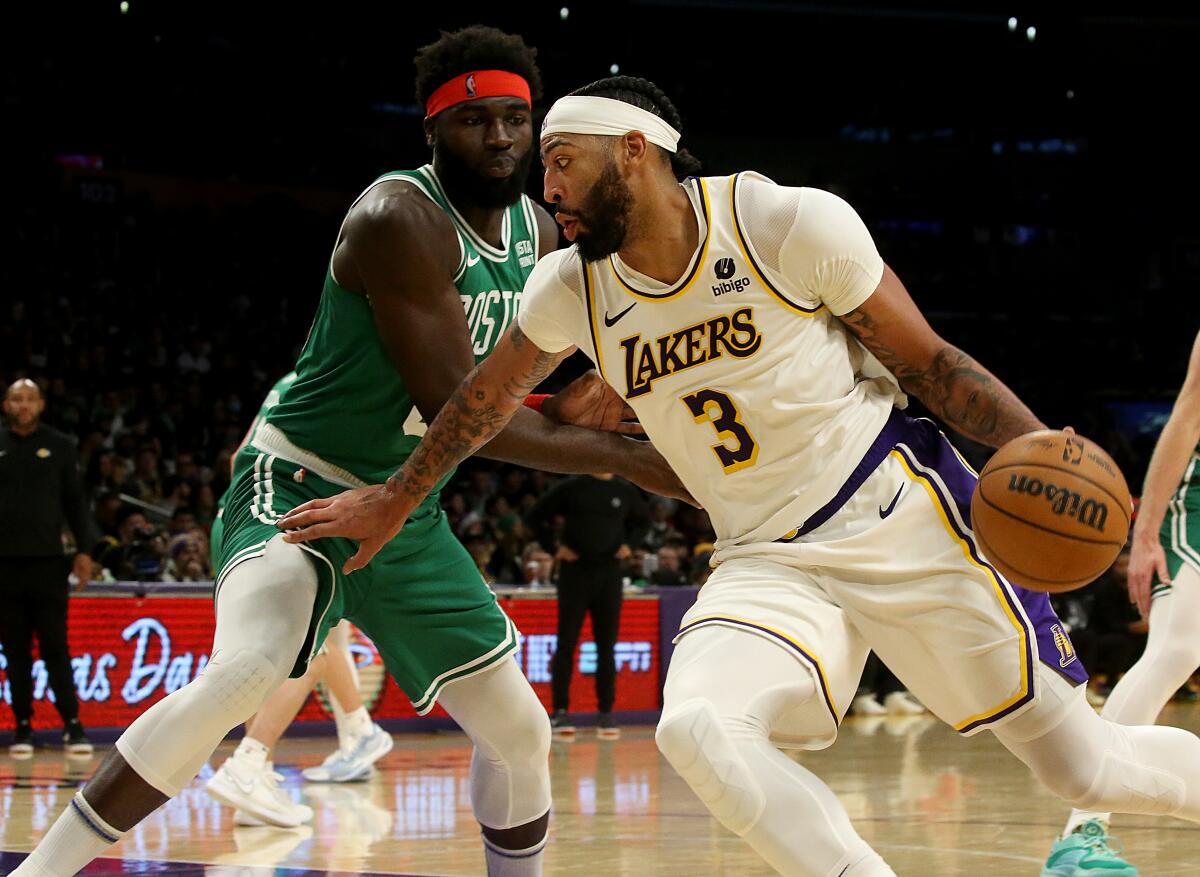 Lakers forward Anthony Davis spins to the basket against the Celtics during the fourth quarter at Crypto.com Arena 