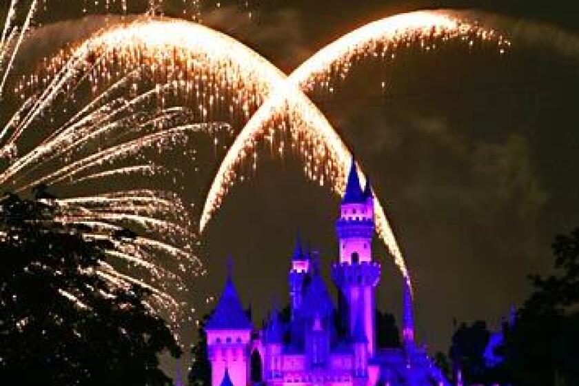 The fireworks show goes off over Sleeping Beauty's castle and Main Street at Disneyland.