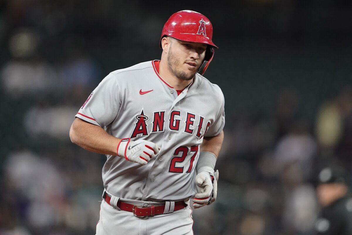 Los Angeles Angels' Mike Trout runs the bases after he hit a two-run home run against the Seattle Mariners during the seventh inning of a baseball game Thursday, June 16, 2022, in Seattle. The homer was Trout's second of the night. (AP Photo/Ted S. Warren)
