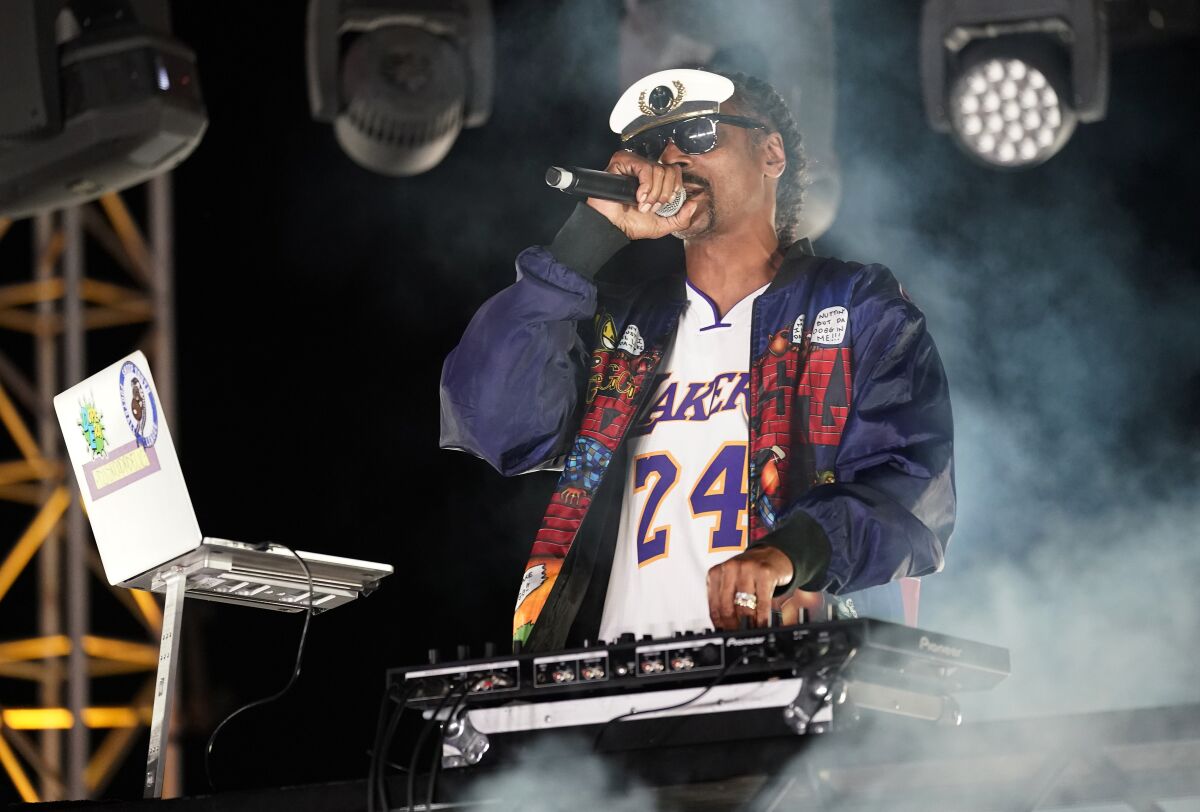 Snoop Dogg performs a DJ set as "DJ Snoopadelic" during the Concerts in Your Car series at the Ventura County Fairgrounds.