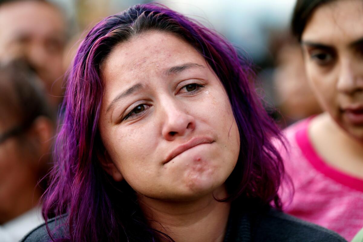 Jennifer Ruiz, 26, attends a vigil for her mother, Rosa "Rosalba" Ruiz, who was killed along with 12 other people in a tour bus crash near Palm Springs.