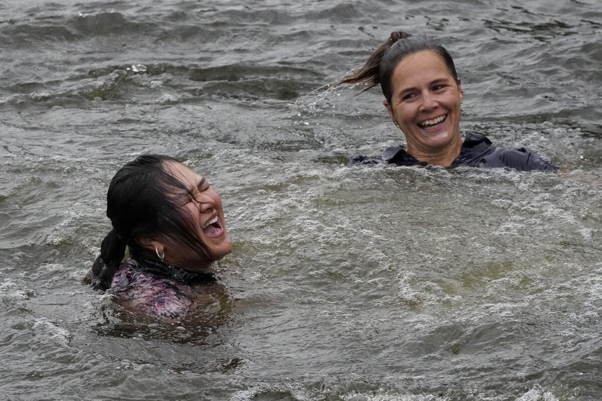 Lilia Vu, left, celebrates in the lake on the 18th hole with Anne-Lise Bidou after winning in a playoff.