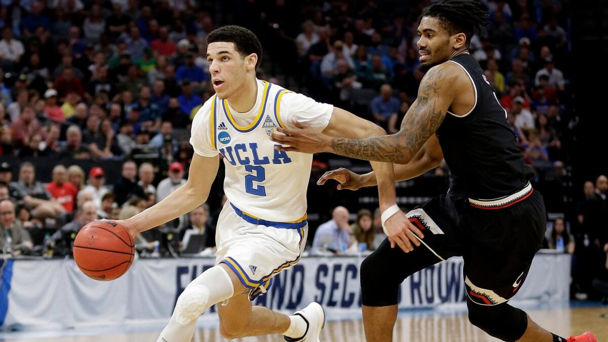 UCLA guard Lonzo Ball playing in the NCAA college basketball tournament on March 19. The team's next game is in South Dakota, which California law prohibits state-funded travel to.