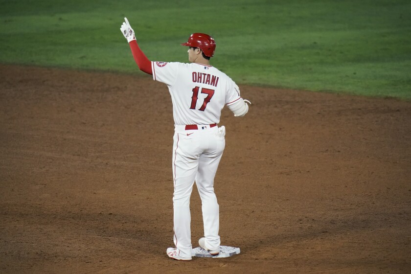 Los Angeles Angels' Shohei Ohtani, of Japan, celebrates his RBI double during the sixth inning of a baseball game against the Los Angeles Dodgers, Friday, May 7, 2021, in Anaheim, Calif. (AP Photo/Jae C. Hong)