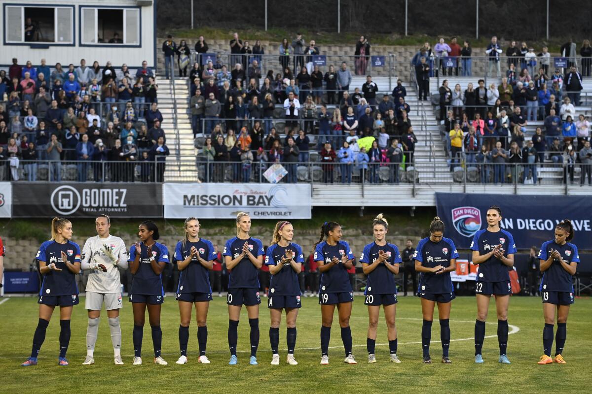 San Diego Wave players line up before a game against the Portland Thorns ON March 26, 2021 in San Diego, Calif. 
