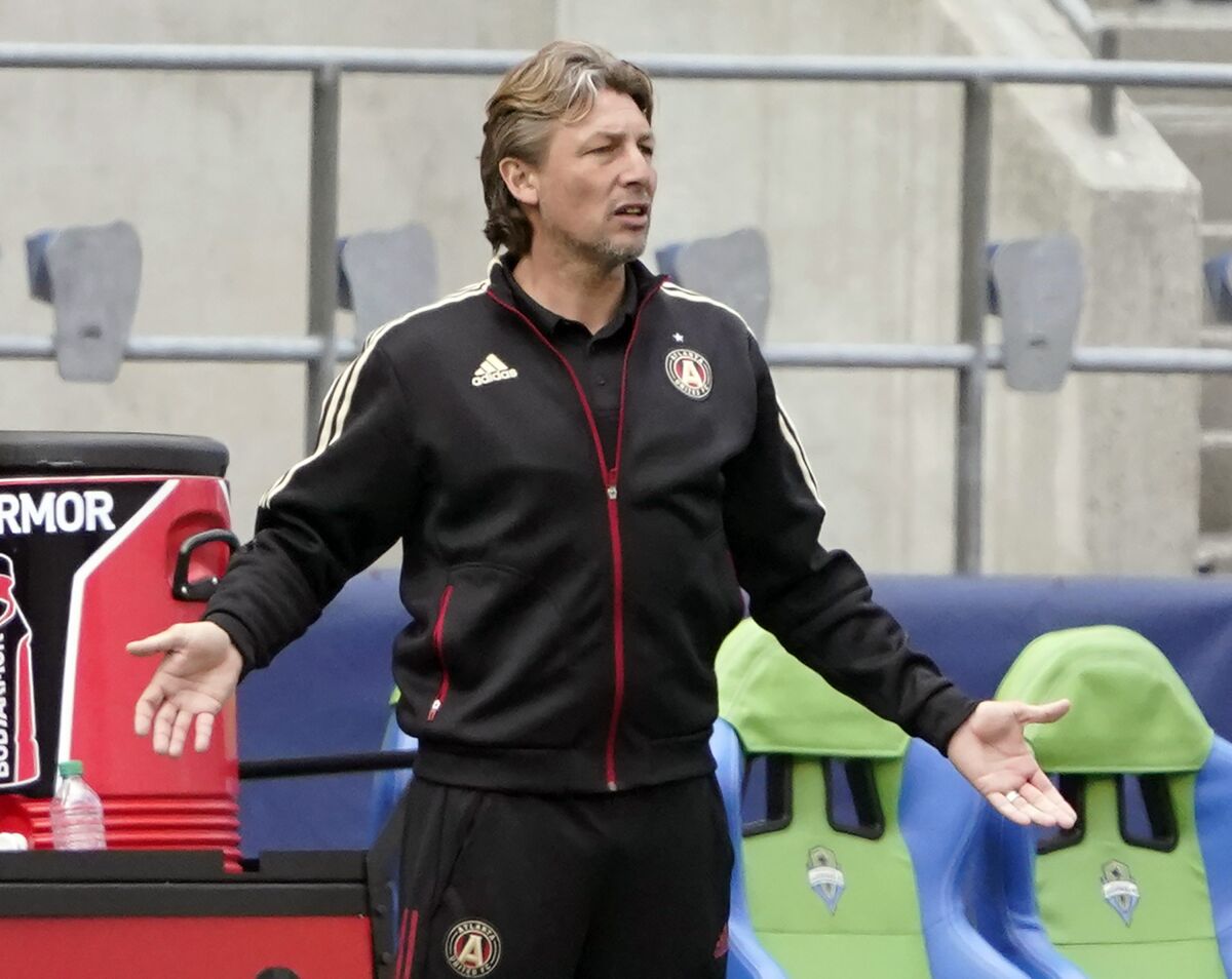 FILE - In this May 23, 2021, file photo, Atlanta United head coach Gabriel Heinze gestures from the bench during the second half of an MLS soccer match against the Seattle Sounders in Seattle. Atlanta United's disappointing 2021 record has cost Heinze his job. Atlanta United fired Heinze on Sunday, July 18, 2021. (AP Photo/Ted S. Warren, File)