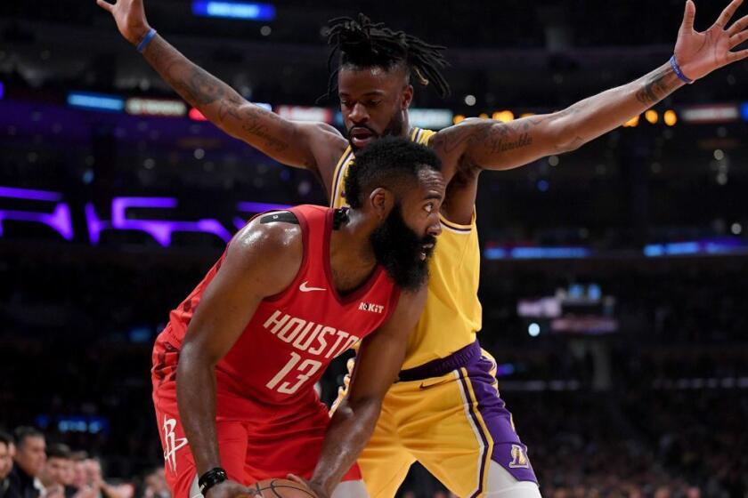 LOS ANGELES, CALIFORNIA - FEBRUARY 21: James Harden #13 of the Houston Rockets is guarded by Reggie Bullock #35 of the Los Angeles Lakers during a 111-106 Laker win at Staples Center on February 21, 2019 in Los Angeles, California. (Photo by Harry How/Getty Images) ** OUTS - ELSENT, FPG, CM - OUTS * NM, PH, VA if sourced by CT, LA or MoD **