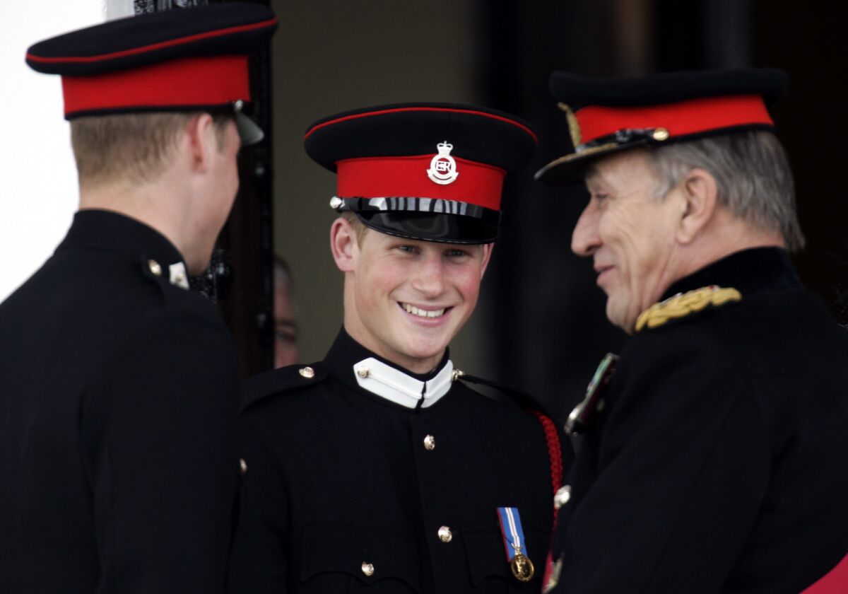 Britain's Prince Harry, center, listens as his brother, Prince William, left, talks with Britain's Chief of General Staff, Gen. Michael Jackson, in 2006.