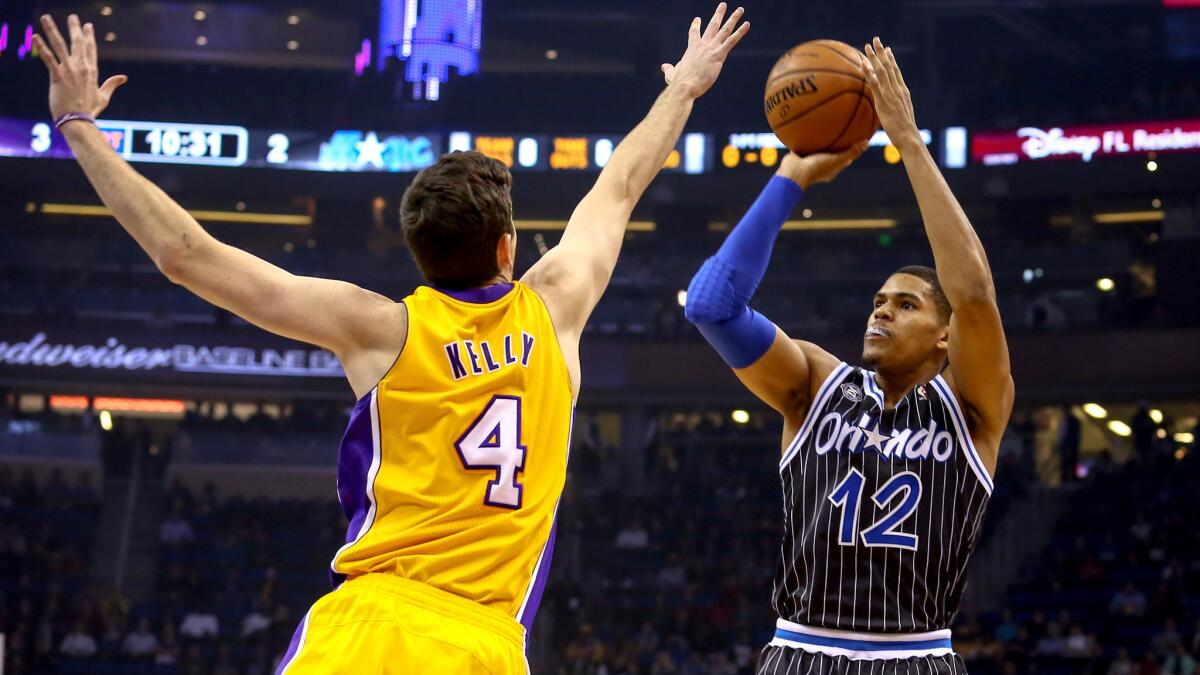 Forward Tobias Harris, pulling up for a shot over Lakers forward Ryan Kelly, will be one of eight players under age 25 for the Magic next season.