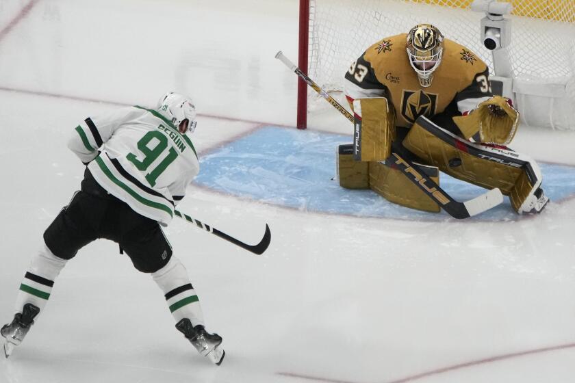 Vegas Golden Knights goaltender Adin Hill (33) blocks a shot by Dallas Stars center Tyler Seguin (91) during the second period in Game 6 of an NHL hockey Stanley Cup first-round playoff series Friday, May 3, 2024, in Las Vegas. (AP Photo/John Locher)
