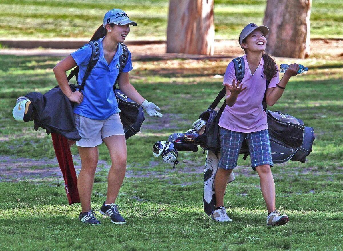 Crescenta Valley High golfers Andrea Han, left, and Laura Perez will look to help the Falcons achieve more success in the Pacific League and CIF in 2013.