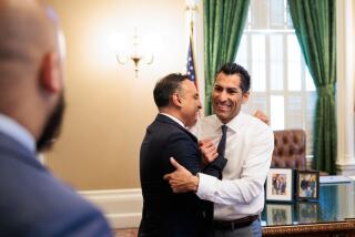 SACRAMENTO CA JUNE 30, 2023 - Assemblymember Robert Rivas, right, embraces Assemblymember Ash Kalra in the Speaker's Office before he's sworn in as Assembly Speaker at the State Capitol in Sacramento, California on June 30, 2023. (Max Whittaker / For The Times)