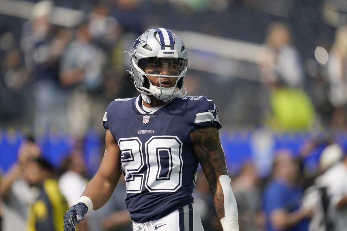 Dallas Cowboys running back Tony Pollard warms up before Sunday's game against the Rams.