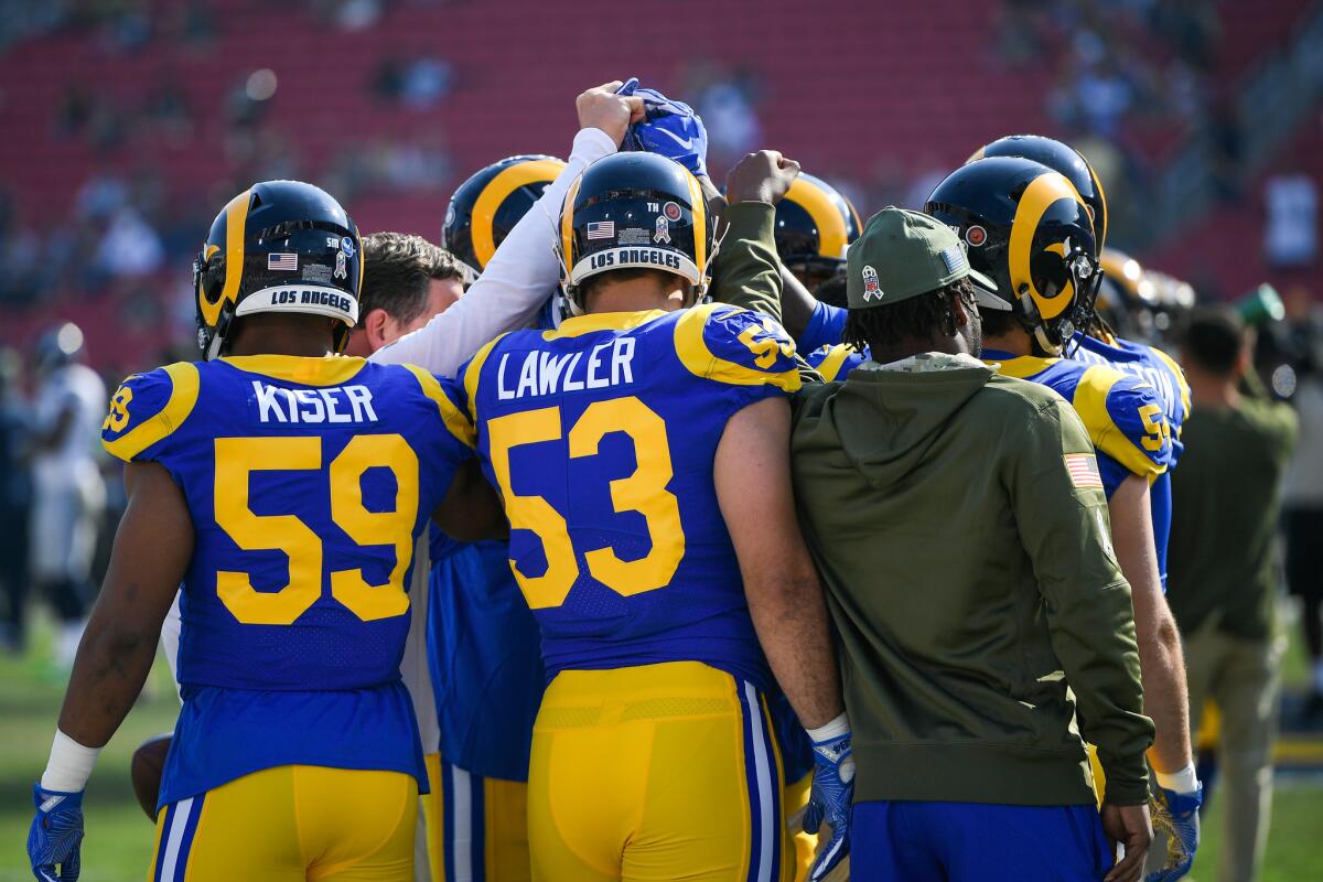 The Los Angeles Rams huddle ahead of their game against the Seattle Seahawks at Los Angeles Memorial Coliseum on November 11, 2018 in Los Angeles, California.