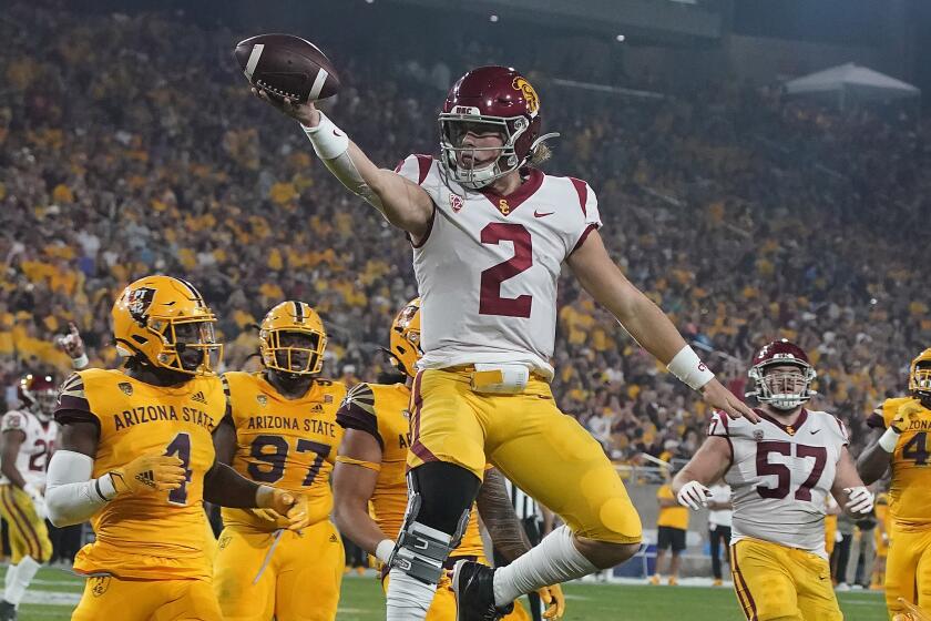 USC quarterback Jaxson Dart celebrates after running for a touchdown against Arizona State 