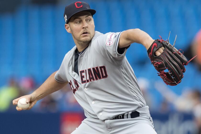 Cleveland Indians starting pitcher Trevor Bauer throws against the Toronto Blue Jays during the first inning of a baseball game, Tuesday, July 23, 2019 in Toronto. (Fred Thornhill/Canadian Press via AP)