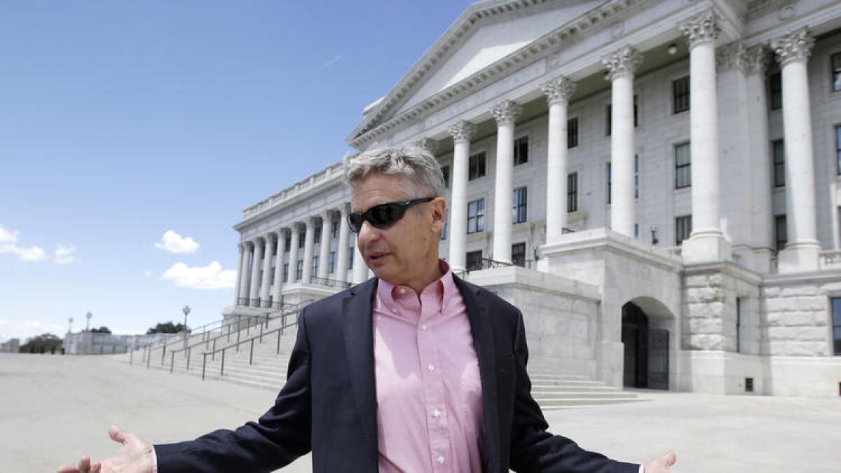 Libertarian Party presidential candidate and former New Mexico Gov. Gary Johnson leaves the Utah Capitol in Salt Lake City.