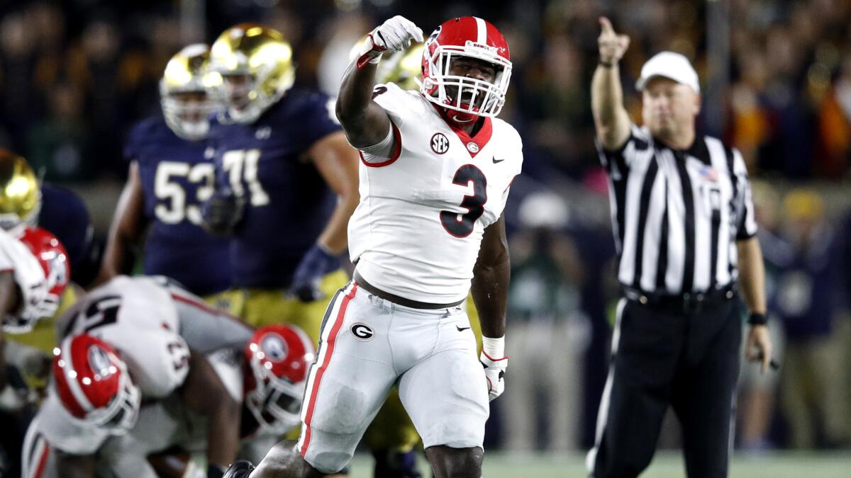 Georgia's Roquan Smith (3) celebrates after a fumble recovery by a teammate in the fourth quarter against Notre Dame at Notre Dame Stadium on Sept. 9, 2017 in South Bend, Ind. Georgia won 20-19.