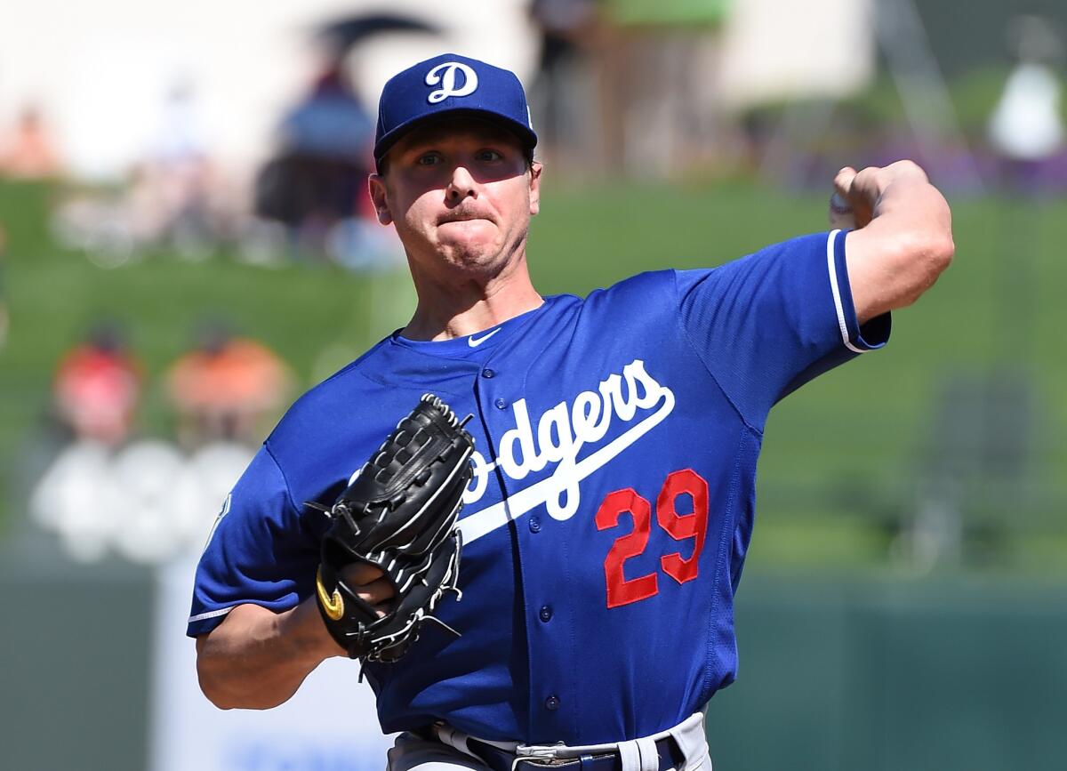 Dodgers left-hander Scott Kazmir warms up before a spring training game against the Texas Rangers on March 4.
