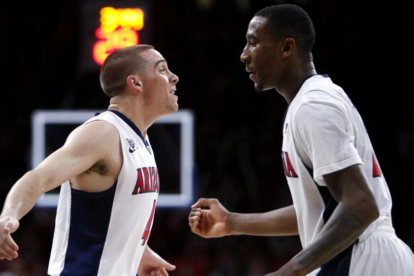 Arizona guard T.J. McConnell, left, and forward Rondae Hollis-Jefferson celebrate during the second half of their rout of Oregon State on Jan. 30.
