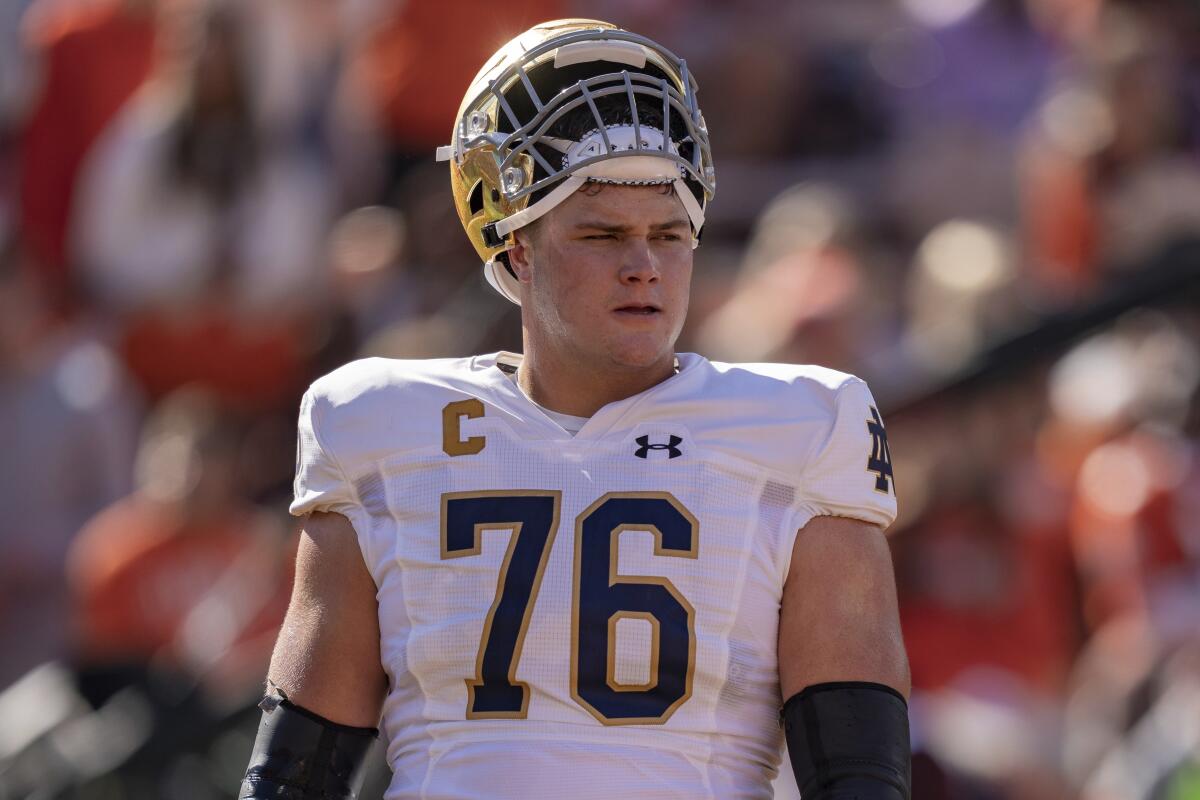 Notre Dame offensive lineman Joe Alt warms up before a game against Clemson.