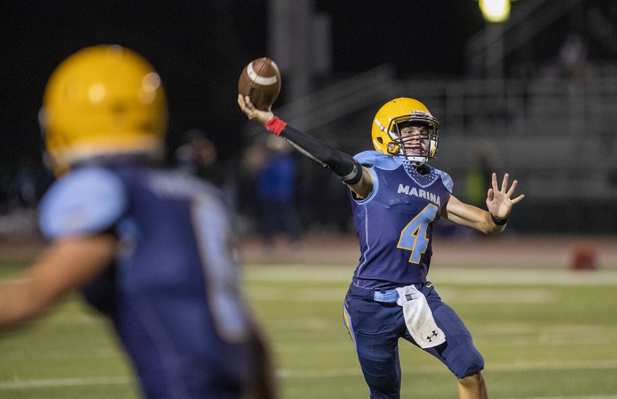 Marina's quarterback Brock Beaver throws a pass during Friday's game.