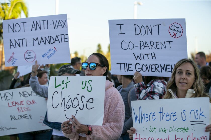 Katherine Savage, center, participates in a rally.