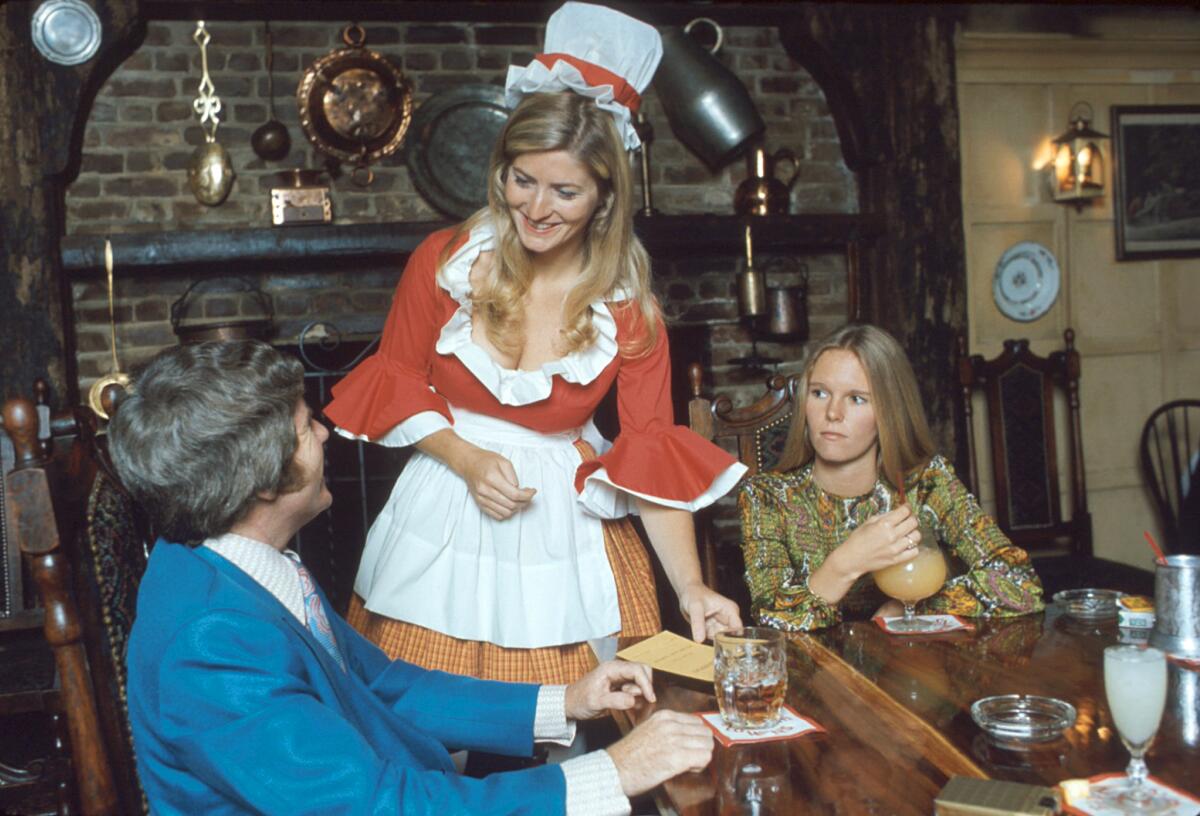 Diners enjoy cocktails while dining at Five Crowns in the 1970s.