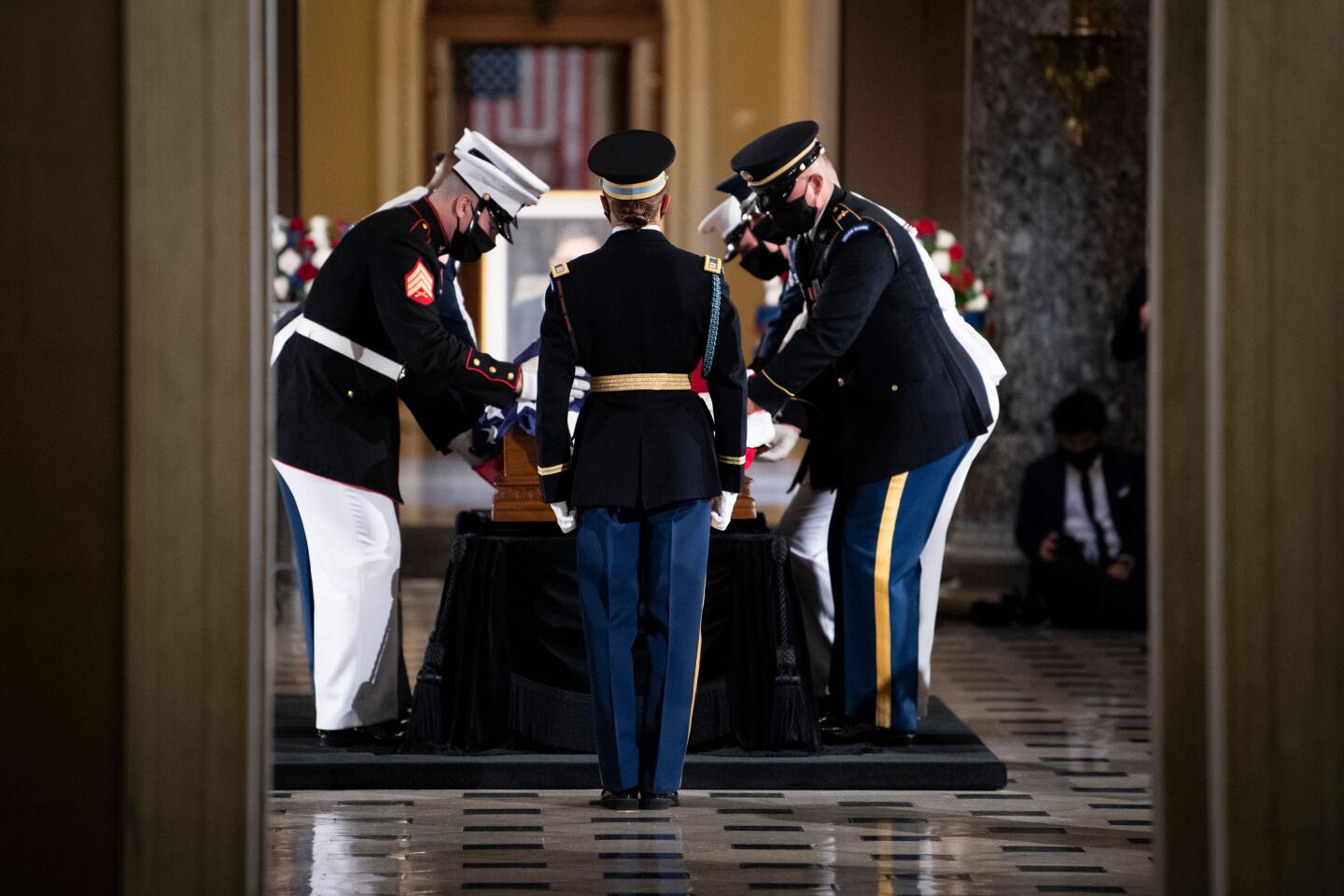 Honor guard places the casket of Justice Ruth Bader Ginsburg in Statuary Hall of the U.S. Capitol to lie in state.