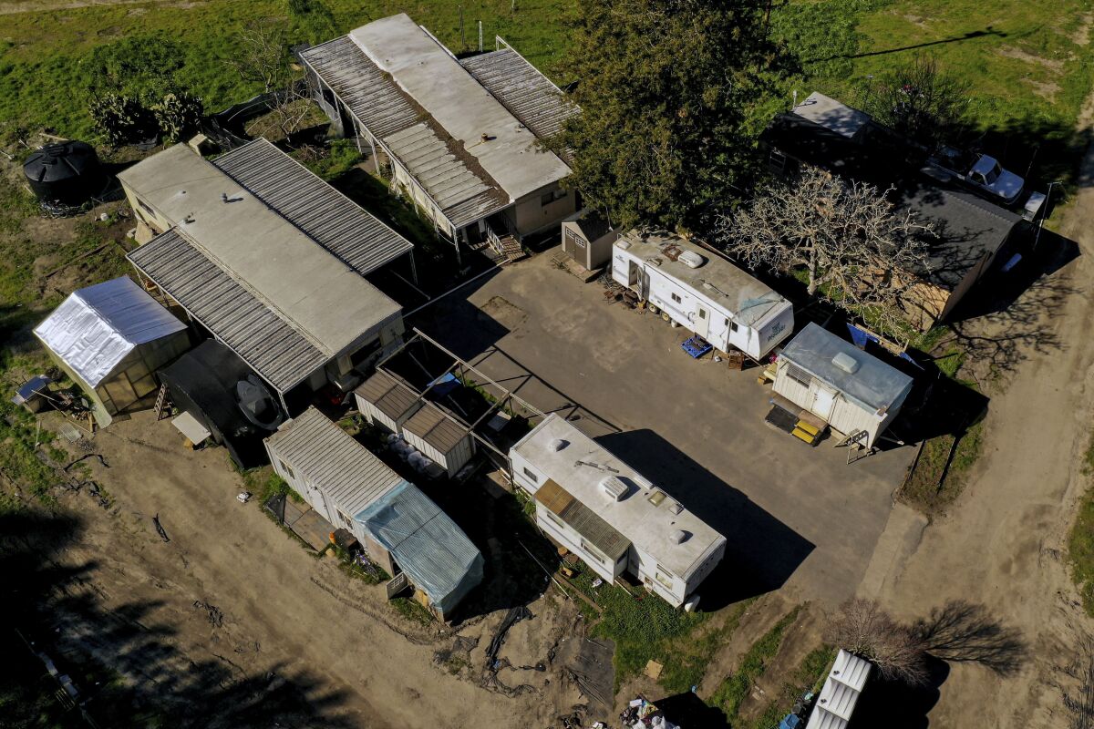 FILE - In this photo taken by a drone, a cluster of mobile homes is seen at the California Terra Garden, formerly Mountain Mushroom Farm in Half Moon Bay, Calif., Thursday, Jan. 26, 2023. Workers who witnessed the Jan. 23, 2023, shooting or worked at one of the farms spoke to The Associated Press on Feb. 2, 2023, about what they saw and their working conditions. Authorities say Chunli Zhao shot and killed seven people and injured an eighth at two mushroom farms where he had worked. (Santiago Mejia/San Francisco Chronicle via AP, File)