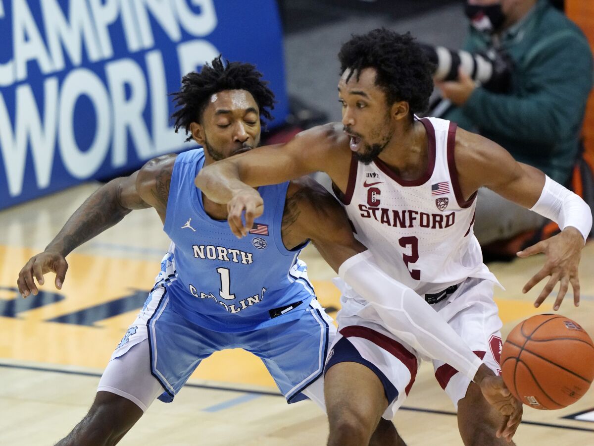 North Carolina guard Leaky Black knocks the ball away from Stanford guard Bryce Wills.