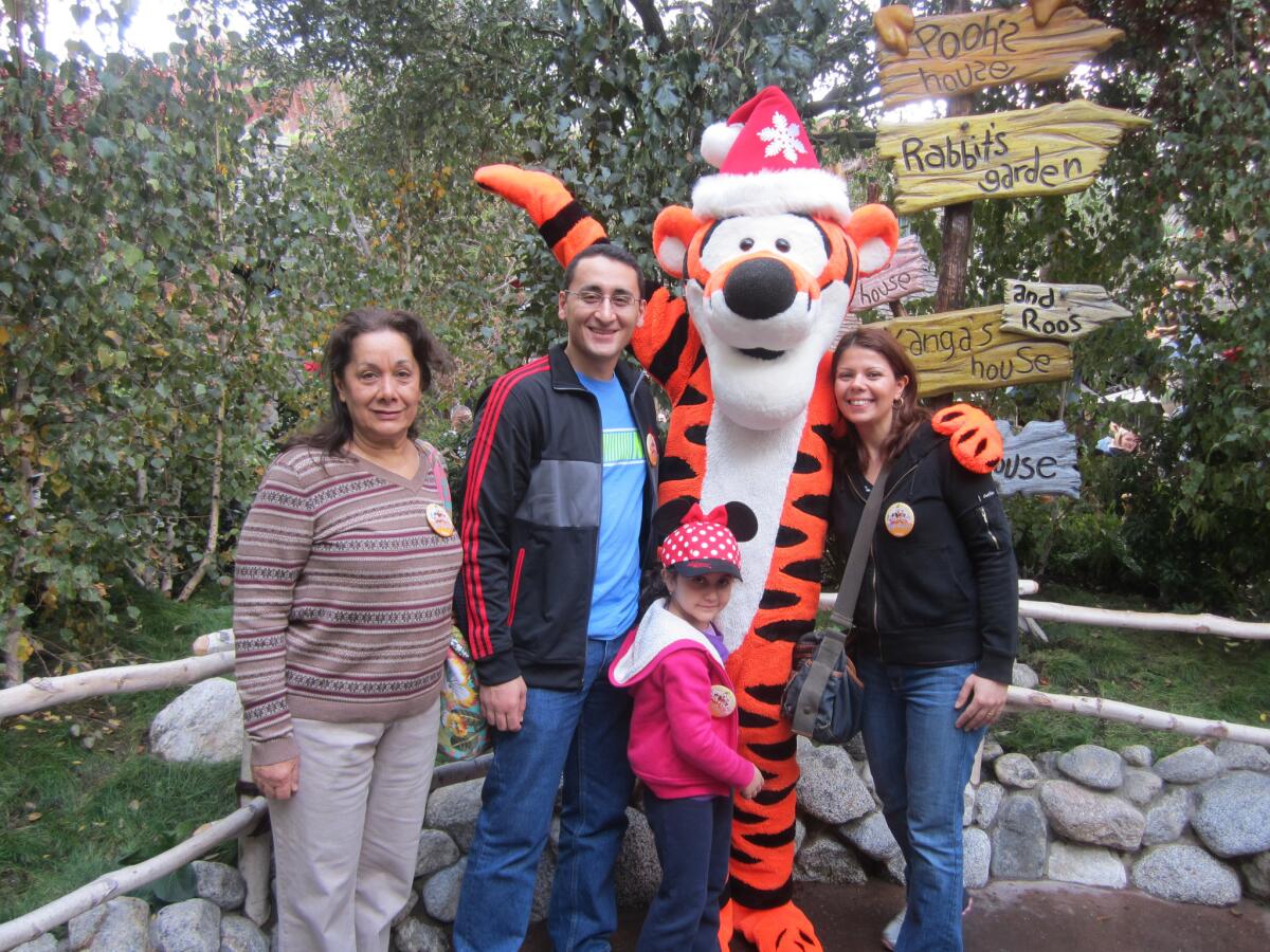 Saif Alnasseri, in glasses, a former translator for The Times' Baghdad bureau, with his family at Disneyland in 2012.