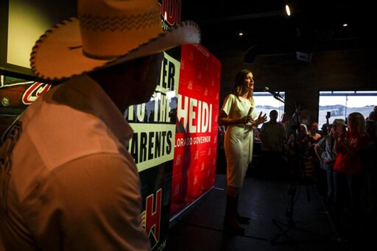 Heidi Ganahl celebrates during a watch party celebrating her Republican primary win for gubernatorial candidacy on Tuesday, June 28, 2022 in Sedalia, Colo. (AAron Ontiveroz/The Denver Post via AP)