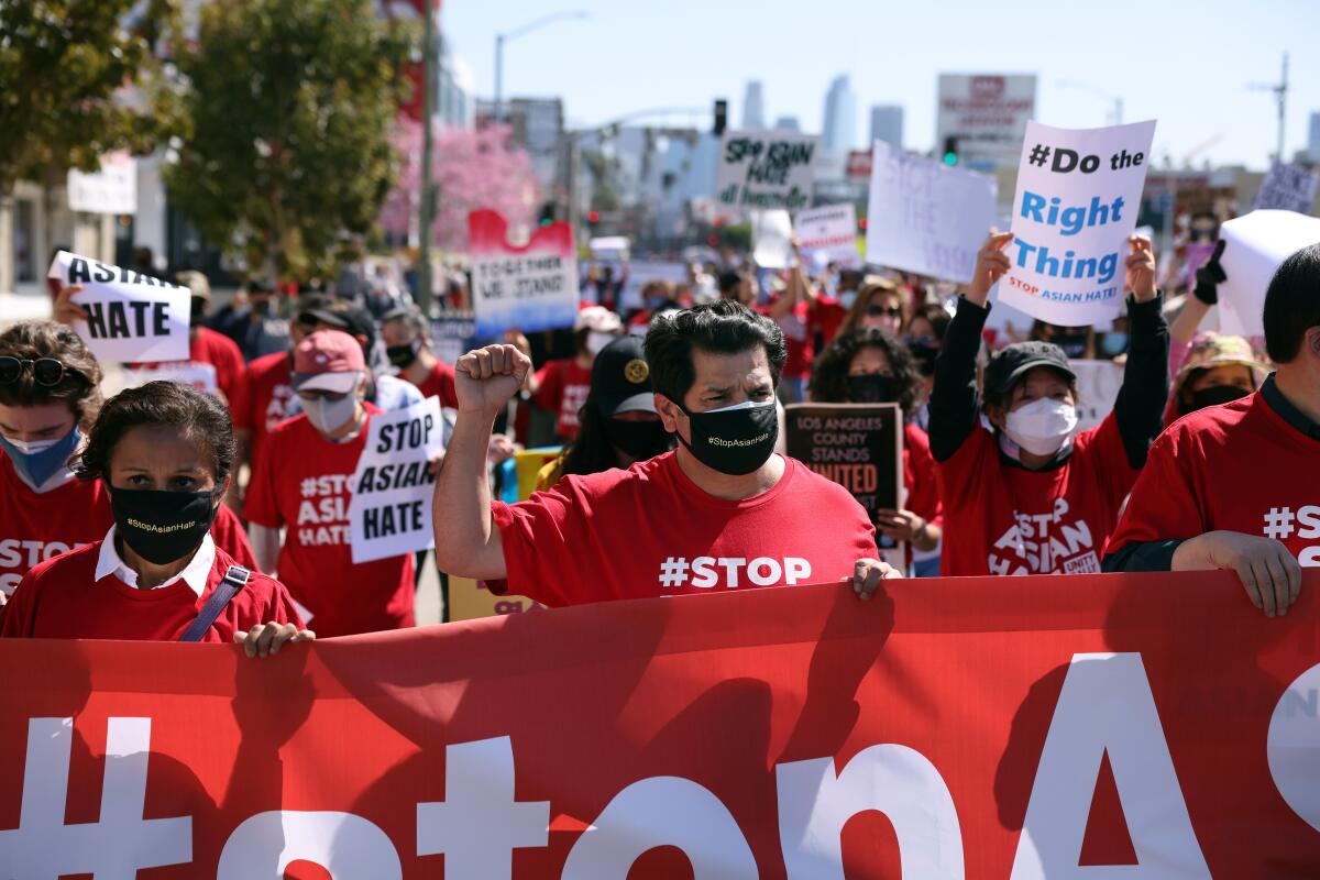 U.S. Representative Jimmy Gomez, center, marches in solidarity