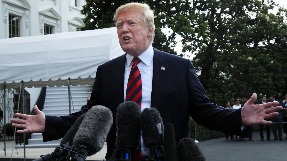President Trump speaks to reporters before leaving the White House on June 8.