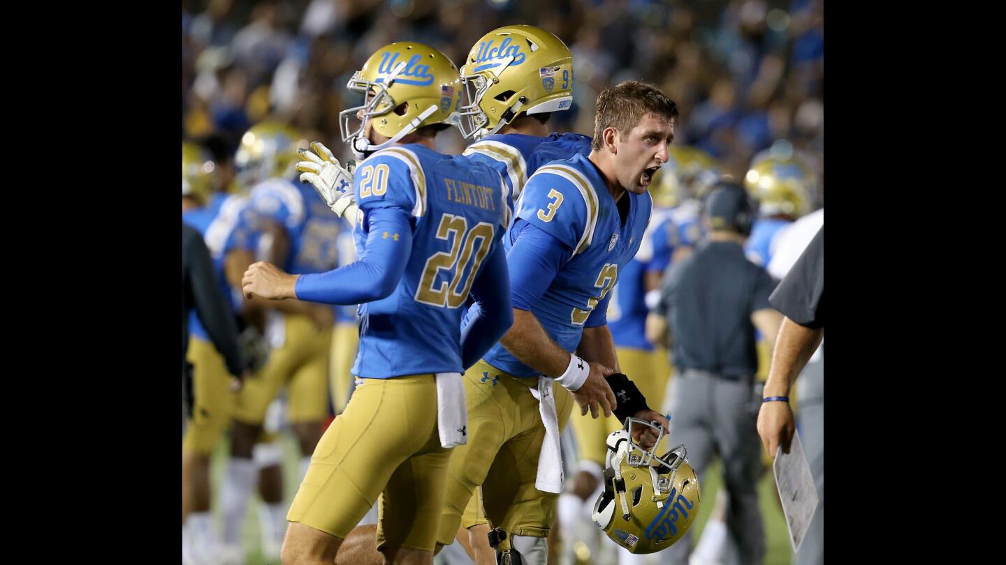 UCLA quarterback Josh Rosen, right, celebrates at the conclusion of a 45-44 comeback victory over Texas A&M.