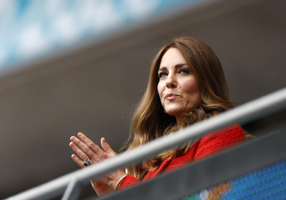 Catherine, Princess of Wales, claps in the stands at a soccer game