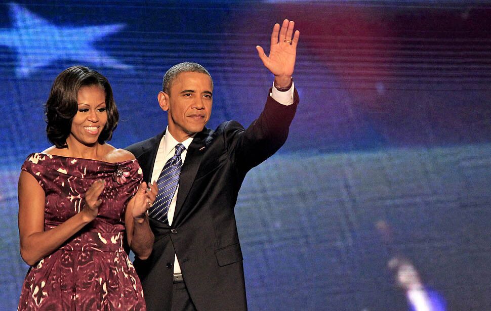 President Obama and First Lady Michelle Obama acknowledge the crowd at the Democratic National Convention.
