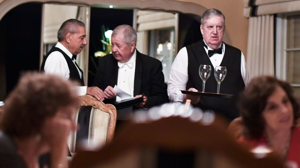 Bobby Bolduc, center, converses with waiters Manuel Castaneda, left, and Stephen Hamlet (Stuart Palley /For The Times)