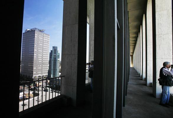 Architect Claude Beelman designed the 1963 Mercury building, left, the former headquarters of Getty Oil. Condos in the building now sell from $400,000 to more than $1 million.