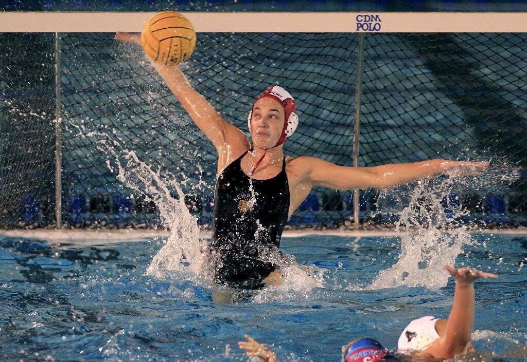 Newport Harbor High goalkeeper Cleo Harrington blocks a shot against Corona del Mar in the Battle of the Bay match on Friday.