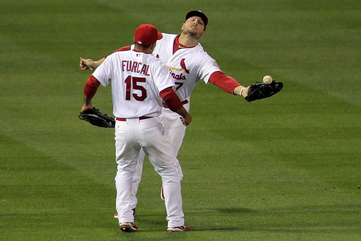 Photo: Cardinals Rafael Furcal jumps over Texas Rangers Mike Napoli during  the World Series in Texas - ARL20111023214 