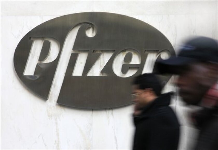 FILE - In this file photo from Jan. 31, 2011, the Pfizer logo is displayed at the drug company's world headquarters in New York. Pfizer Inc. said Tuesday, May 3, 2011 its first-quarter profit rose 10 percent, due to lower costs for production and research and a smaller tax bill. (AP Photo/Mark Lennihan, file)