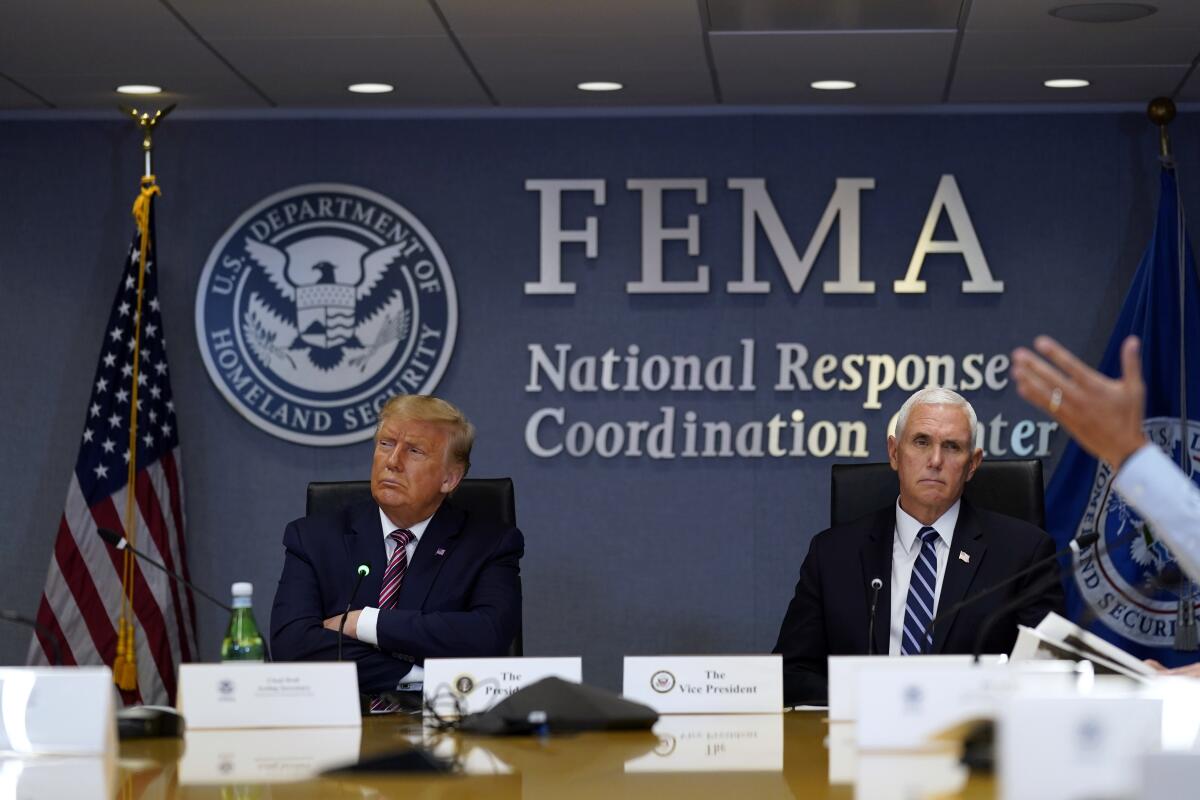 President Trump and Vice President Mike Pence at a Hurricane Laura briefing at FEMA headquarters on Thursday.