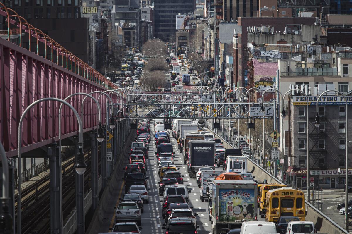 FILE - Congested traffic from Brooklyn enters Manhattan off the Williamsburg Bridge, March 28, 2019, in New York. New York is inching toward becoming the first U.S. city to charge motorists an extra fee for entering its most congested areas. (AP Photo/Mary Altaffer, File)