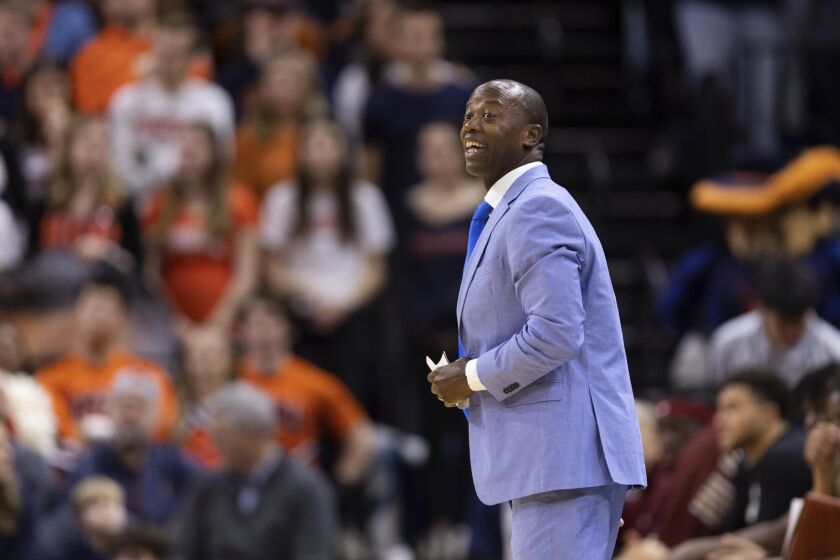 Boston College head coach Earl Grant yells to his team during the first half of an NCAA college basketball game against Virginia in Charlottesville, Va., Saturday, Jan. 28, 2023. (AP Photo/Mike Kropf)