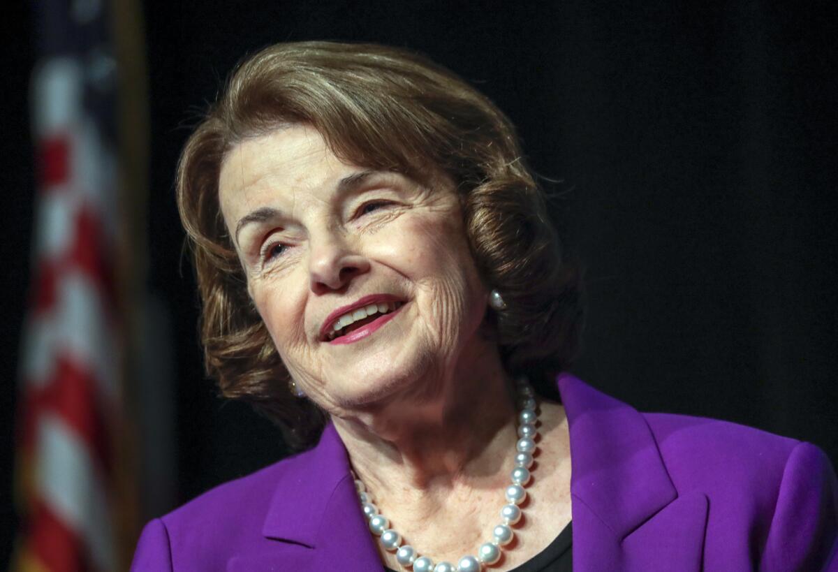 Sen.Dianne Feinstein (D-Calif.) wears a purple business suit and pearls