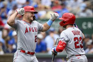 Los Angeles Angels' Mike Trout, left, celebrates his home run against the Kansas City Royals.