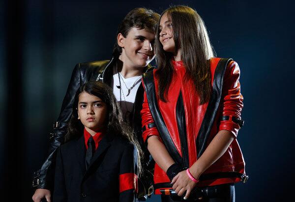 Michael Jackson's children (L-R) Blanket, Prince and Paris stand on stage during the "Michael Forever" tribute concert in Cardiff, Wales.