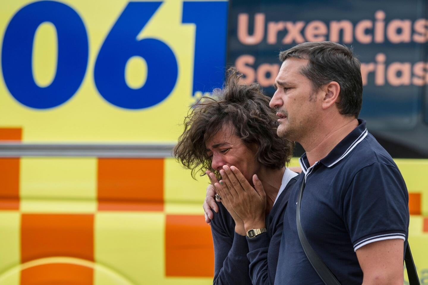 Relatives of passengers involved in the train crash wait for news at the Cersia Building in Santiago de Compostela.